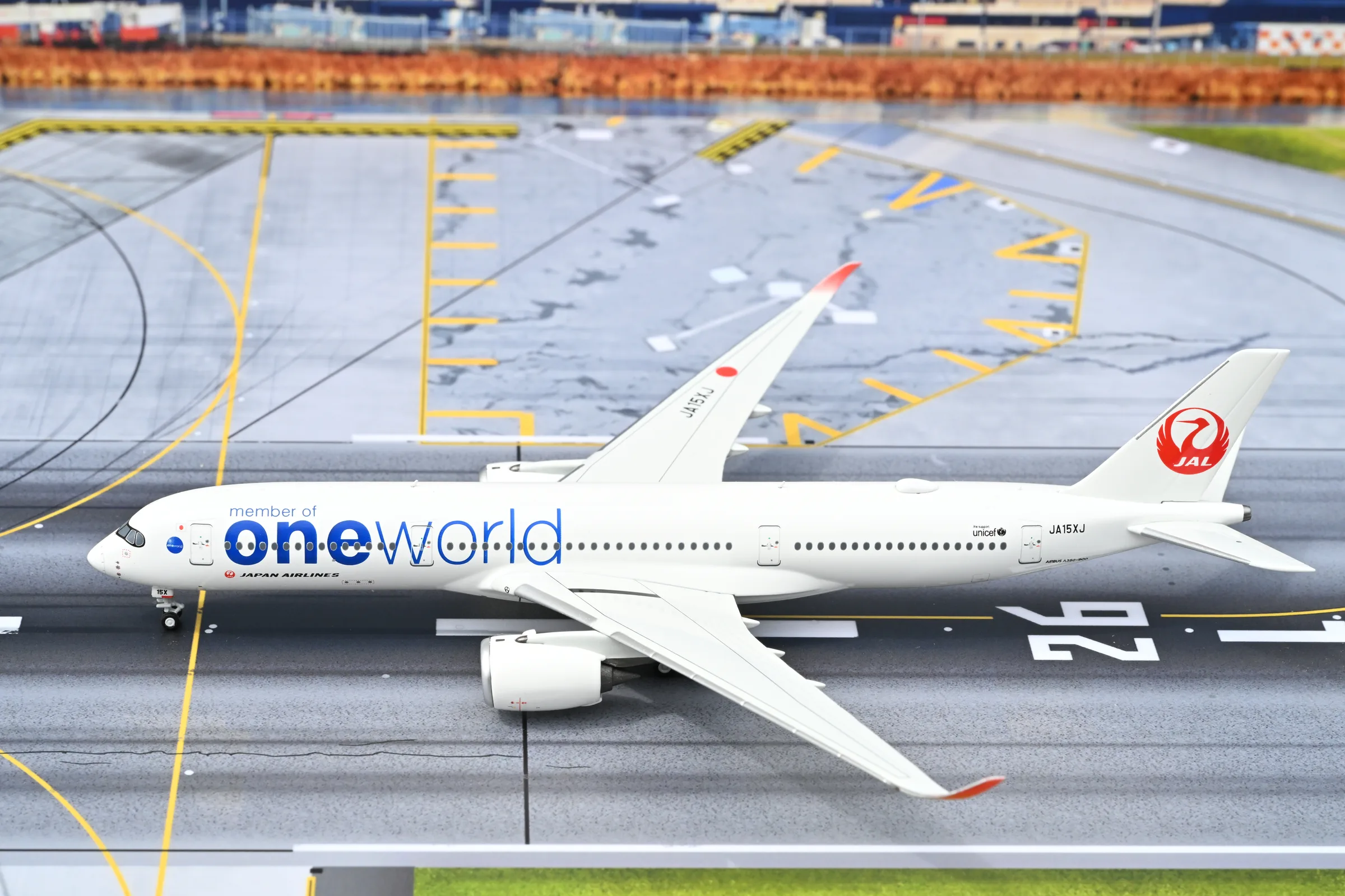 1:400 scale model of a Japan Airlines oneworld Airbus A350 on the home runway