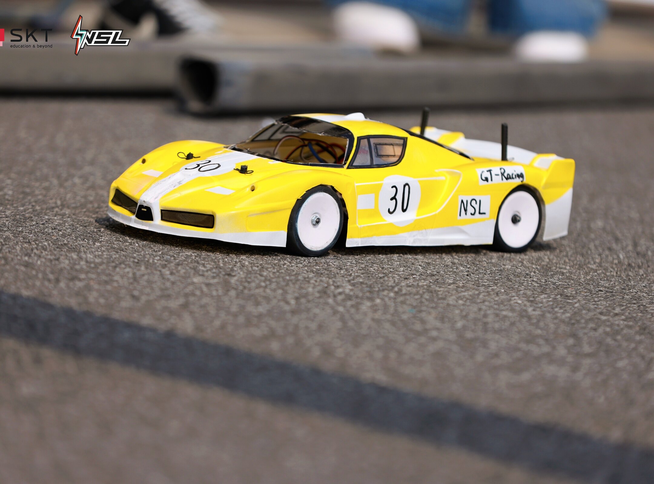 The yellow GT Racing number 30 car on the competition surface