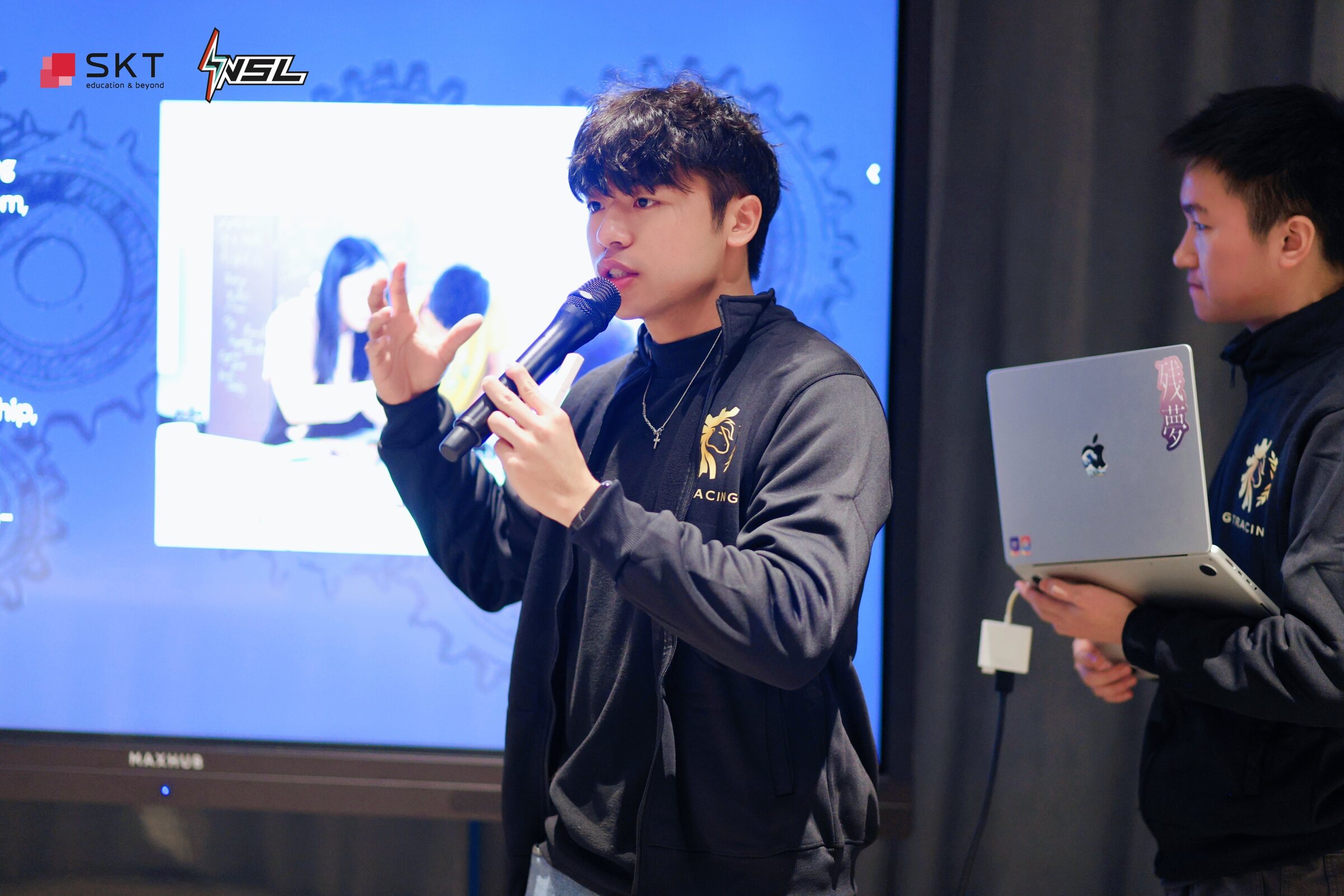 Two GT Racing members presenting the club's work at NSL China 2026